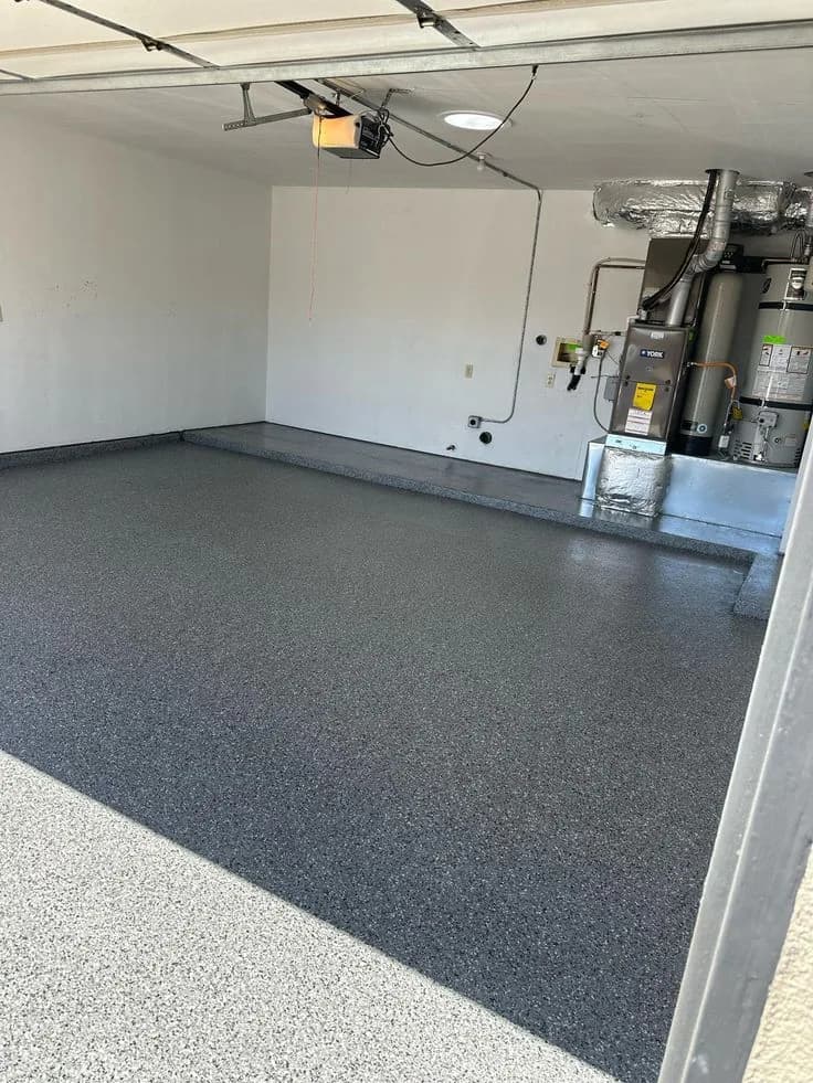 Blue and grey flake epoxy floor in a domestic garage