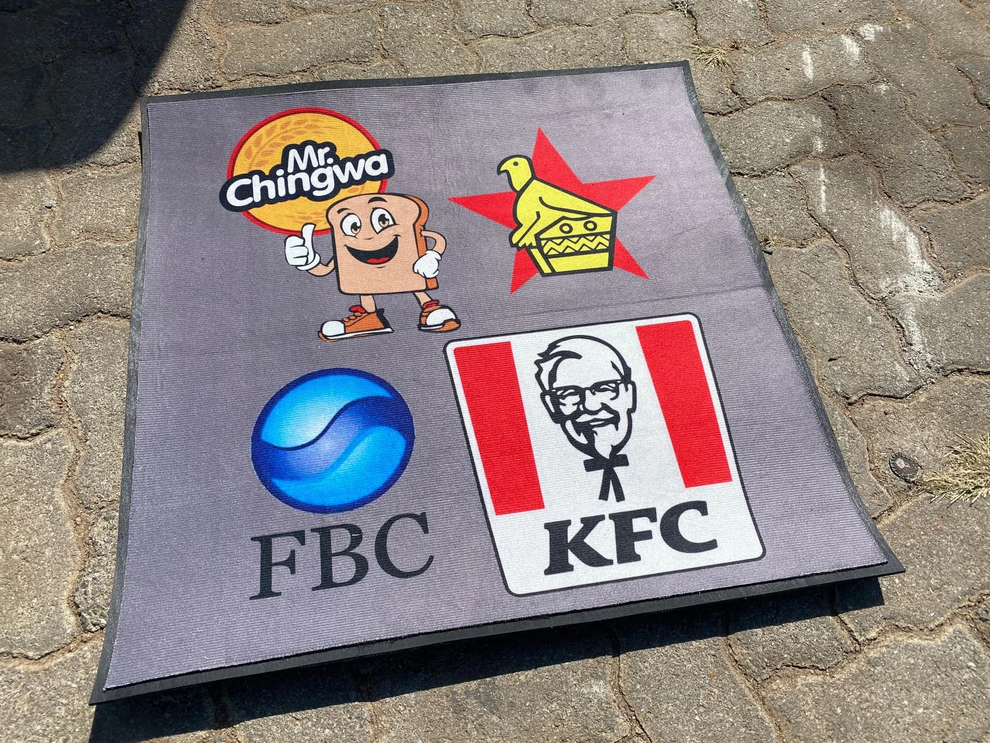 FBC, KFC and Mr Chingwa branded entrance mats ready for delivery