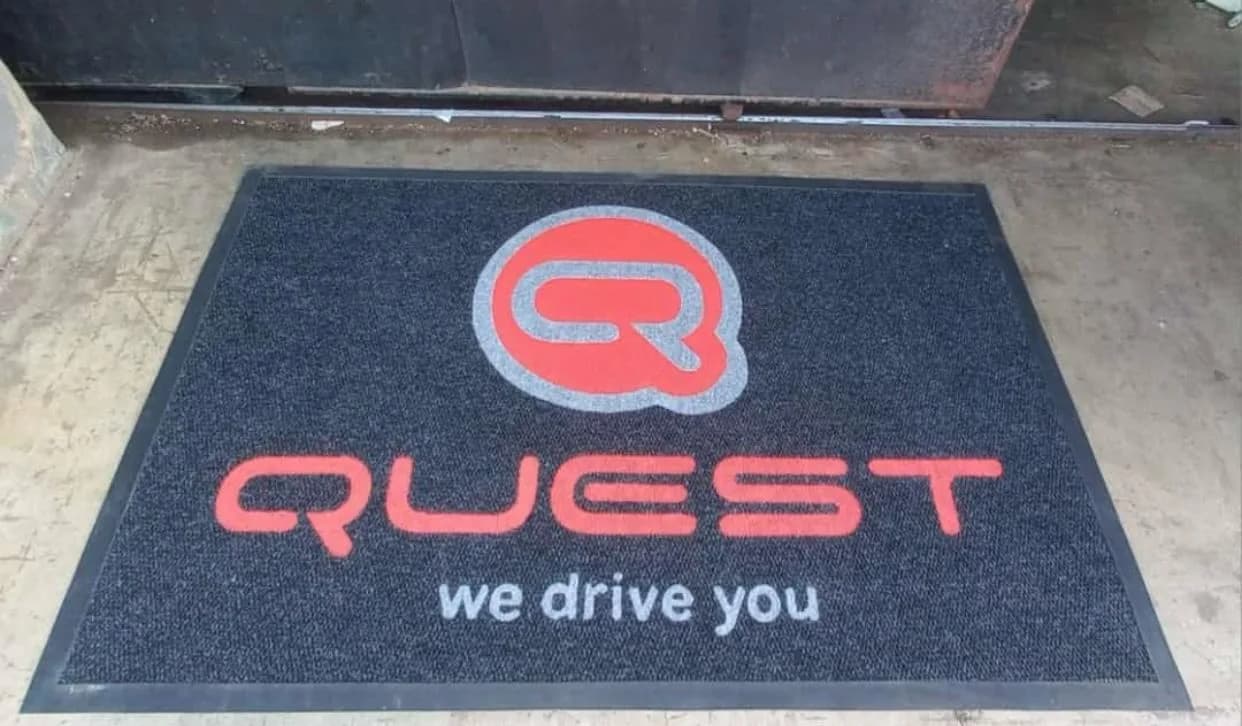 Long branded mat in a machinery showroom entrance