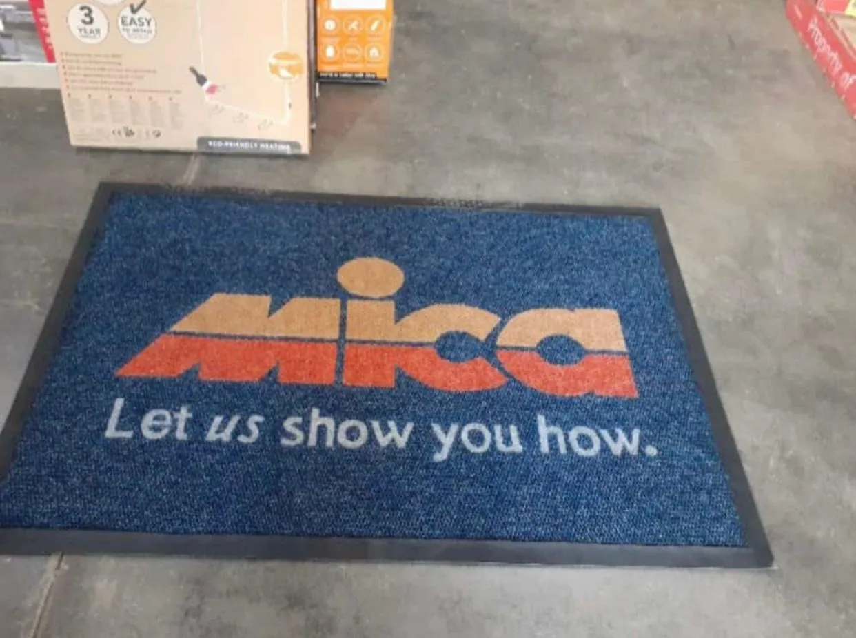 Hardware retailer entrance mat with a printed logo