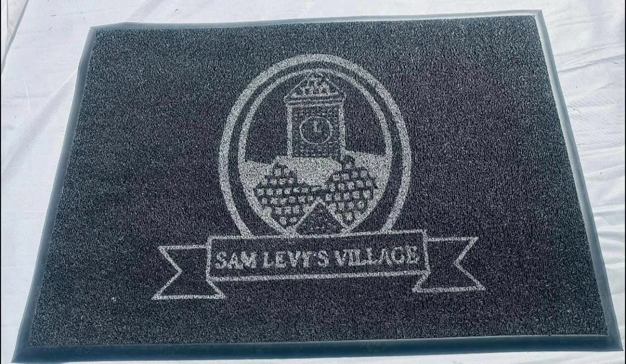 Sam Levy's Village branded entrance mat