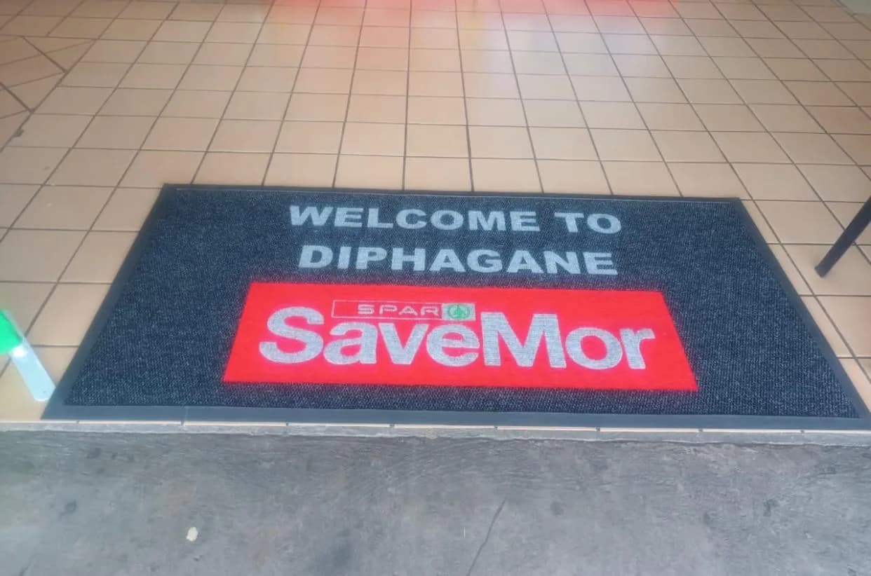 Retail entrance mat with a full-colour brand logo