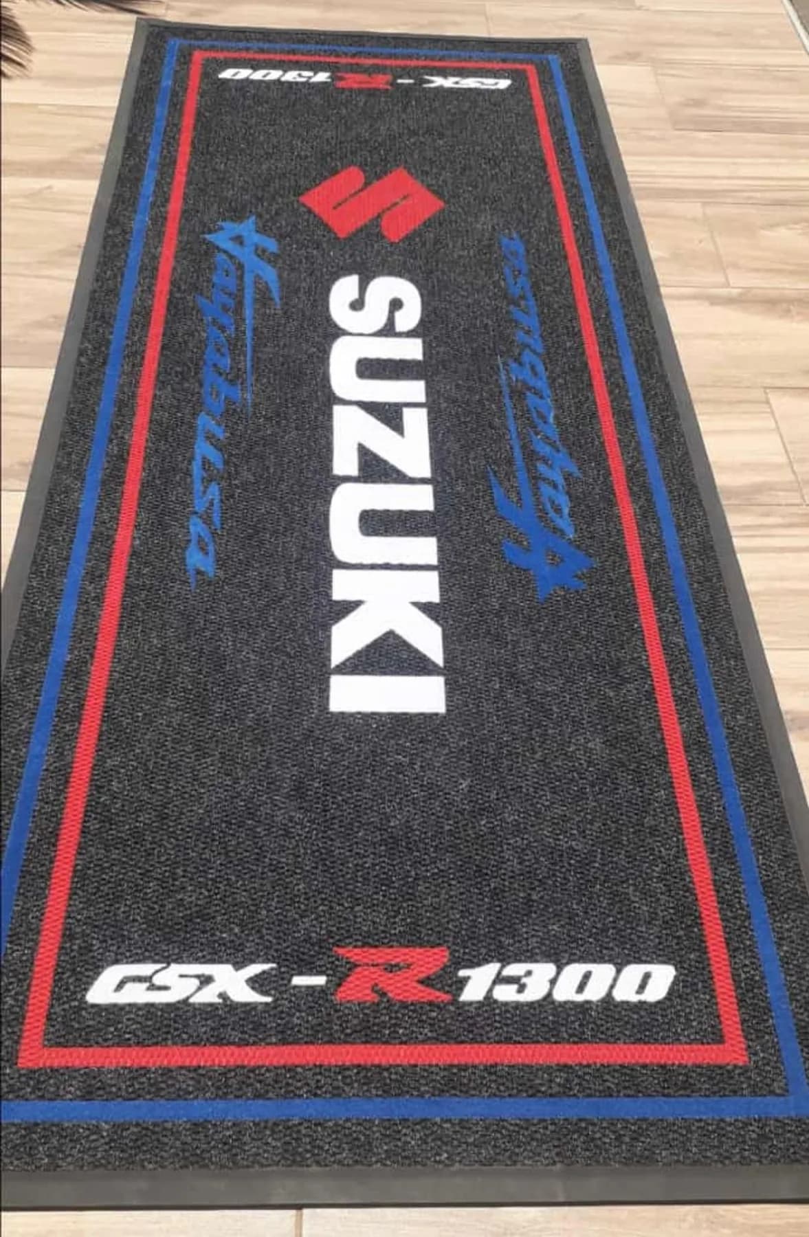 Long branded runner mat in a motorcycle showroom