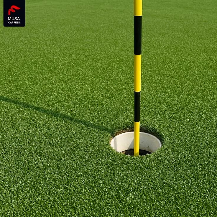 Close-up of a putting green cup and striped flag pin