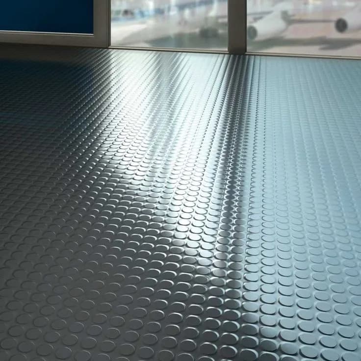 Anti-slip rubber flooring beside an indoor pool