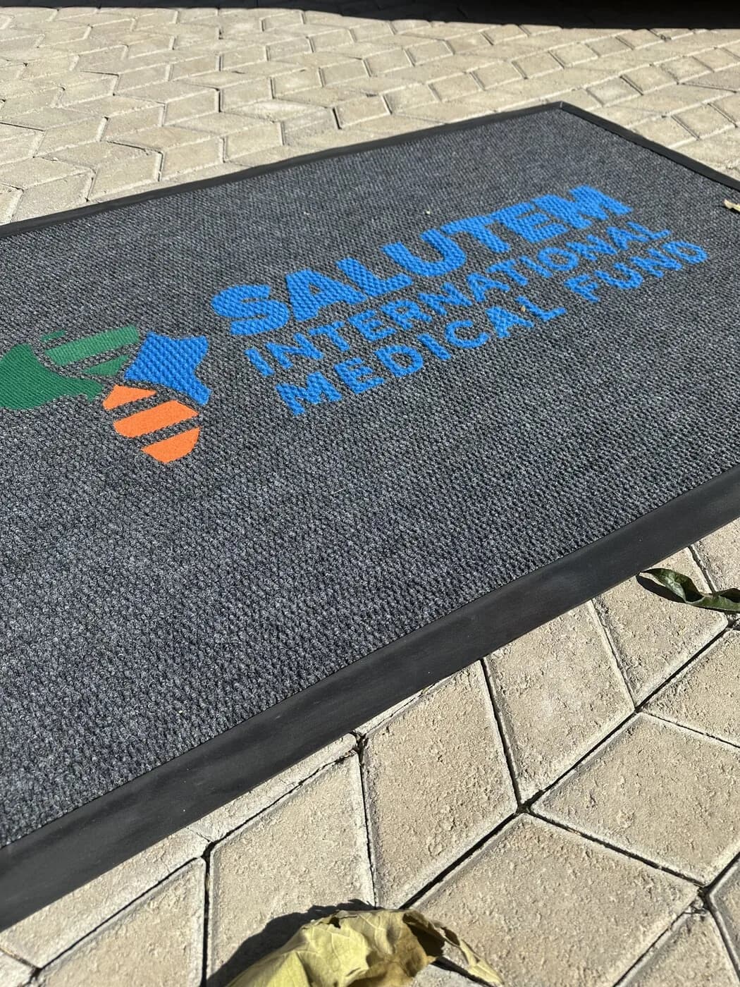 Salutem branded entrance mat at a healthcare entrance