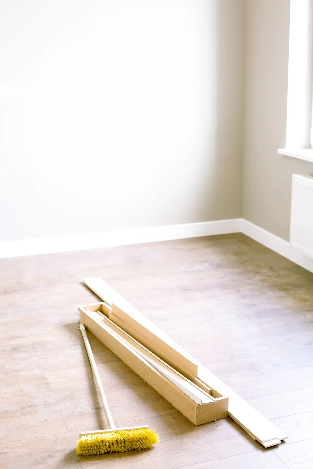 Vinyl planks and tools laid out during an installation