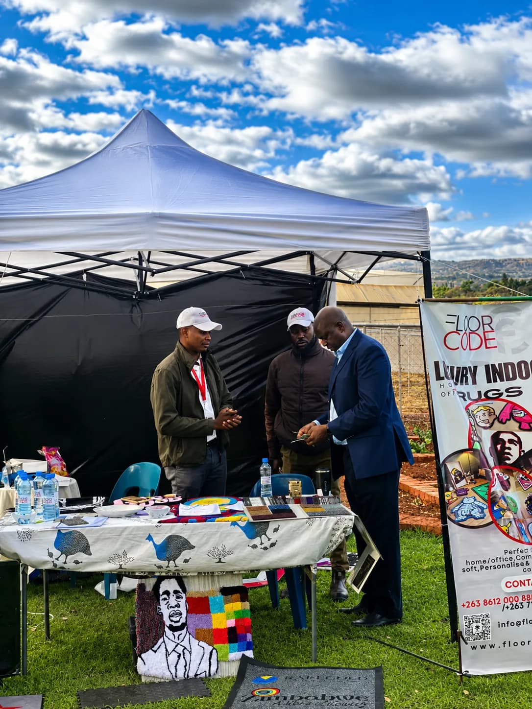 FloorCode Zimbabwe stand being set up at a trade exhibition