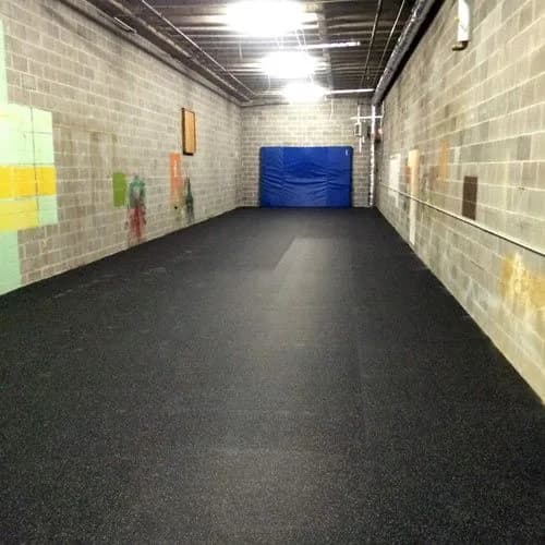Recycled rubber flooring running down a service corridor